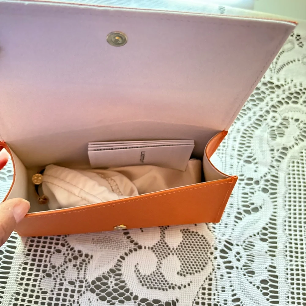 Tory Burch sunglasses or eyeglasses case.